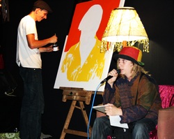 Looney Poets December 2010 Issac Cayce reading poetry while Marc Steiner paints in the background
